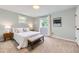 Comfortable bedroom features two windows, neutral walls, and well-appointed furnishings at 284 S Lincoln Ave, Louisville, CO 80027