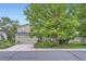 Charming two-story home with a well-manicured lawn, mature trees, and an attached two-car garage at 284 S Lincoln Ave, Louisville, CO 80027