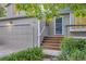 Inviting home entrance features wooden steps, a storm door, and a well-maintained front yard with lush greenery at 284 S Lincoln Ave, Louisville, CO 80027