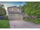 Charming two-story home with a well-maintained lawn and a large two car garage at 284 S Lincoln Ave, Louisville, CO 80027