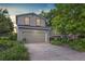 Charming two-story home with a well-maintained lawn, mature trees, and an attached two-car garage at 284 S Lincoln Ave, Louisville, CO 80027
