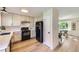 Well-equipped kitchen with updated appliances, bright cabinetry, and smooth countertops, adjacent to the dining area at 284 S Lincoln Ave, Louisville, CO 80027