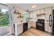 Modern kitchen with white subway tile backsplash, stainless steel appliances, and plenty of natural light at 284 S Lincoln Ave, Louisville, CO 80027