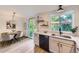 Bright and modern kitchen with stainless steel appliances, sleek countertops, and seamless access to the outdoor deck at 284 S Lincoln Ave, Louisville, CO 80027