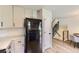 Bright kitchen features white cabinets, stainless steel refrigerator, and modern finishes at 284 S Lincoln Ave, Louisville, CO 80027