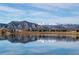 Scenic lake view featuring clear water, mountains in the background, and a calm reflection at 284 S Lincoln Ave, Louisville, CO 80027