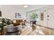 Cozy living room with lots of light, contemporary decor, and a large window overlooking the landscaped yard at 284 S Lincoln Ave, Louisville, CO 80027