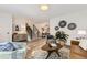 Open concept living space featuring modern finishes, a staircase, and seamless flow into the dining area at 284 S Lincoln Ave, Louisville, CO 80027