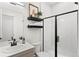 Modern bathroom with walk-in shower, floating shelves, and updated vanity at 2121 Hummingbird Way # 204, Georgetown, CO 80444