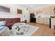 Modern living room features a brown sectional sofa and a cozy faux fur ottoman at 2121 Hummingbird Way # 204, Georgetown, CO 80444