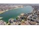 Breathtaking aerial view showcases waterfront homes and a serene lake, offering an idyllic living experience at 6848 Zenobia St # 9, Westminster, CO 80030