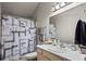 Bathroom featuring a sink, a shower with grey patterned shower curtain, and great lighting at 6848 Zenobia St # 9, Westminster, CO 80030