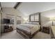 Comfortable main bedroom featuring a large bed, two windows, soft carpet, and neutral color palette at 6848 Zenobia St # 9, Westminster, CO 80030