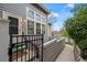 Exterior view of the home with front gate, walkway, well-manicured landscaping, and front porch area at 6848 Zenobia St # 9, Westminster, CO 80030