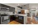 Beautiful kitchen with stainless steel appliances and view of the living room fireplace at 6848 Zenobia St # 9, Westminster, CO 80030