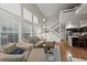 Open-concept living room with vaulted ceilings, hardwood floors, and easy access to the kitchen at 6848 Zenobia St # 9, Westminster, CO 80030