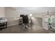 Cozy office space features a desk, comfortable chair, and natural light from the adjacent staircase and window at 6848 Zenobia St # 9, Westminster, CO 80030