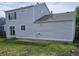 Picture of the house's backyard, which includes a grassy yard and a patio at 5151 Jasper St, Denver, CO 80239