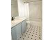 Updated bathroom featuring a new vanity with stone countertop, modern fixtures, and tiled shower with tub at 5151 Jasper St, Denver, CO 80239