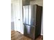 Stainless steel Samsung refrigerator with french door and bottom freezer at 5151 Jasper St, Denver, CO 80239