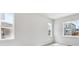 Bright bedroom with large windows offering neighborhood views and ample natural light at 1400 Colony Dr, Erie, CO 80026