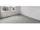 Spacious bedroom with neutral carpeting and large windows providing ample natural light at 1400 Colony Dr, Erie, CO 80026