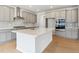 Modern kitchen features stainless steel appliances, a spacious island, and stylish grey cabinets at 1400 Colony Dr, Erie, CO 80026