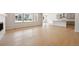 Spacious living room with hardwood floors and large windows for natural light at 1400 Colony Dr, Erie, CO 80026