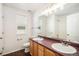 Bathroom featuring a double vanity, walk-in shower, and window at 5479 Lost Meadow Trl, Castle Rock, CO 80104