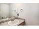Powder room with a vanity sink, mirror, neutral walls, and light fixtures at 5479 Lost Meadow Trl, Castle Rock, CO 80104