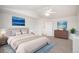 Primary bedroom with vaulted ceiling, ceiling fan, king bed, carpet, and an ensuite bath at 5479 Lost Meadow Trl, Castle Rock, CO 80104