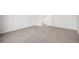 Bedroom with neutral walls and carpet, a white door, and a view of the stairs at 5479 Lost Meadow Trl, Castle Rock, CO 80104