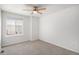 Bedroom featuring carpet flooring, a ceiling fan, and a large window at 5479 Lost Meadow Trl, Castle Rock, CO 80104