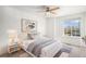 Bedroom featuring neutral walls and carpet, a large window and stylish decor at 5479 Lost Meadow Trl, Castle Rock, CO 80104