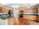 Well-equipped kitchen featuring stainless steel appliances, hardwood floors, and ample cabinet space at 5479 Lost Meadow Trl, Castle Rock, CO 80104