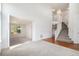 Bright, open living room with neutral carpet, staircase, and lots of natural light at 5479 Lost Meadow Trl, Castle Rock, CO 80104