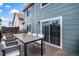 Outdoor patio with dining table, chairs, and sliding glass door access to home's interior at 5479 Lost Meadow Trl, Castle Rock, CO 80104
