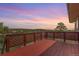 Inviting outdoor deck featuring a wooden railing with scenic views at 19855 Draco Dr, Monument, CO 80132