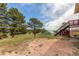 View of trees and backyard at 19855 Draco Dr, Monument, CO 80132