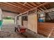 Barn interior with wooden beams and stalls at 19855 Draco Dr, Monument, CO 80132