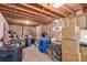 Spacious basement with exposed wooden beams, perfect for storage or finishing to your liking at 19855 Draco Dr, Monument, CO 80132