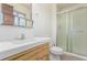 Bathroom with tiled floors, vanity, mirrored cabinet, and walk-in shower at 19855 Draco Dr, Monument, CO 80132