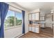 Dining area with large window that provides natural light and beautiful views adjacent to the kitchen at 19855 Draco Dr, Monument, CO 80132