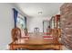Traditional dining room with wood table and blue curtains at 19855 Draco Dr, Monument, CO 80132