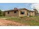 Charming single-story home with a well-maintained lawn and mature trees offering a serene and private setting at 19855 Draco Dr, Monument, CO 80132