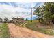 A view of the back of the home from the long driveway at 19855 Draco Dr, Monument, CO 80132