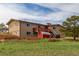 Charming two-story home with a deck and a red storage shed at 19855 Draco Dr, Monument, CO 80132