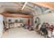 Shed interior featuring a workbench, saddle, and ample storage space at 19855 Draco Dr, Monument, CO 80132