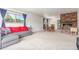 Open-concept living space with a fireplace and dining area, creating a cozy and inviting atmosphere at 19855 Draco Dr, Monument, CO 80132