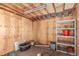 Wooden-walled storage room with shelves and various containers at 19855 Draco Dr, Monument, CO 80132